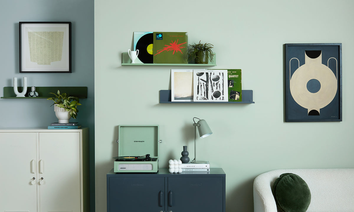 The Midi locker in Navy blue with a turntable, plus The Ledge shelves in Sage green and Navy displaying vinyl records