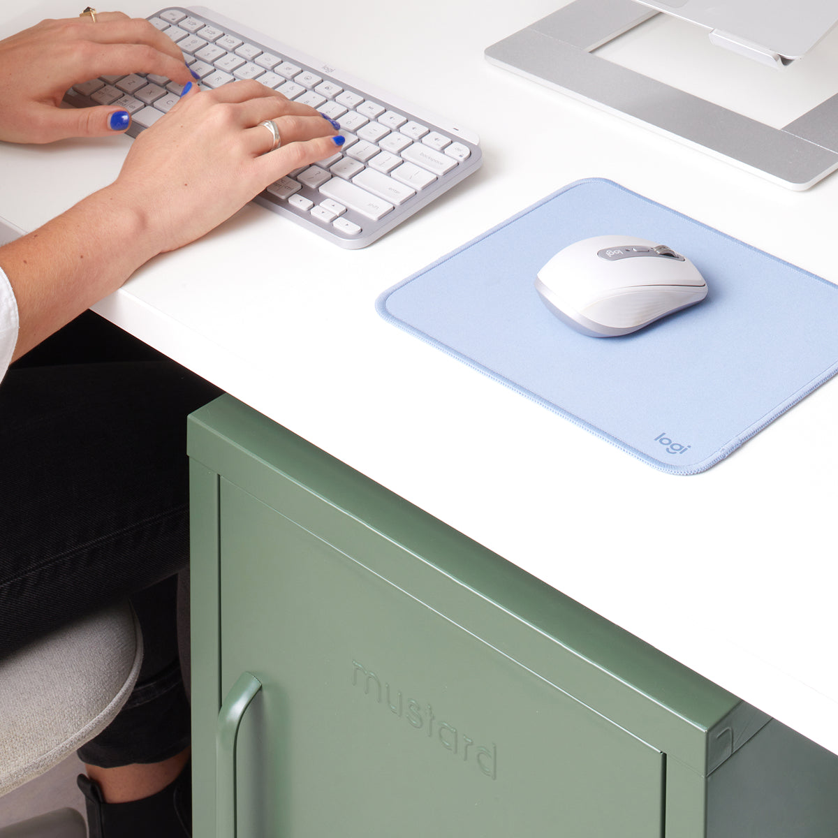 The Shorty locker in Sage green tucked under a white desk