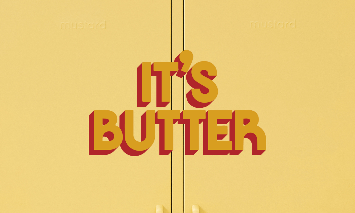 Gros plan d'un casier à beurre avec un texte graphique indiquant "IT'S BUTTER".