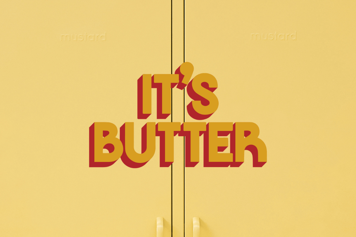 Gros plan d'un casier à beurre avec un texte graphique indiquant "IT'S BUTTER".
